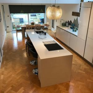 a kitchen with a island in the middle of a room at Snowdon View in Llanberis