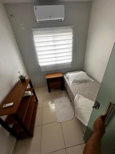 Llit o llits en una habitació de Edifício Metrópole - Apto
