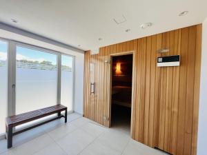 a room with a bench and a walk in closet at Ferienwohnung Aquamarin im Haus Arkona Prora in Binz