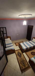 a room with two beds sitting on the floor at Ighbola Ouzoud in Ouzoud +17 photos