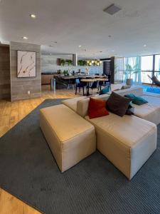 a living room with a couch and a table at Skylux By Cris Borriello Luxury in Rio de Janeiro