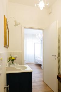 a bathroom with a sink and a mirror at Dolce Conero Guest House in Camerano