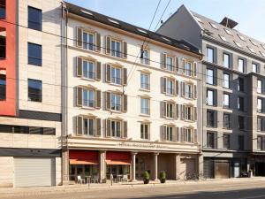 a large white building on the side of a street at Classik Hotel Hackescher Markt - Self Check In in Berlin