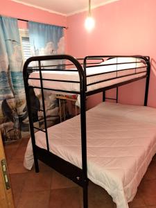 a couple of bunk beds in a room at Il Marinaio in Messina
