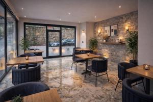 a restaurant with tables and chairs in a room at Airport Corner Hotel in Trabzon