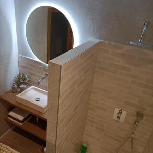 a bathroom with a sink and a mirror at Can Freixa in Sant Pere de Torelló
