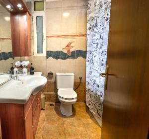 a bathroom with a toilet and a sink at Zeas Yacht View in Piraeus +46 photos