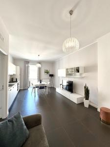 a living room with a couch and a table at The Superhost - Duomo Apt in Crotone +11 photos