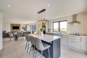 a kitchen and dining room with a table and chairs at 4 Bed in Crosby oc-b31135 in Northallerton