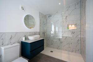 a bathroom with a toilet and a sink and a mirror at 4 Bed in Crosby oc-b31135 in Northallerton +44 photos