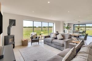 a living room with a couch and a fireplace at 4 Bed in Crosby oc-b31135 in Northallerton