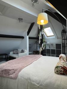 a bedroom with a large bed and a couch at West ave exeter in Exeter