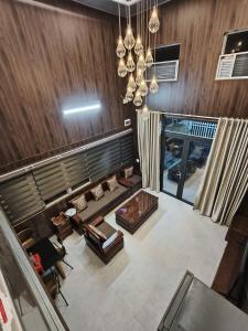 an overhead view of a living room with a couch at Ánh Dương House 2 in Da Thanh +13 photos