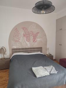 Llit o llits en una habitació de KaranosHouse