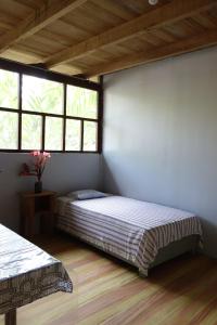 Postel nebo postele na pokoji v ubytování Isuyama Hostel