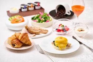 a table topped with plates of food and drinks at Imperial Hotel, Kyoto in Kyoto +211 photos