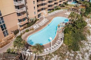 an overhead view of a swimming pool in a apartment building at Pelican Beach 1216 - Ocean Front Condo with Shared Pool & Beach Access in Destin