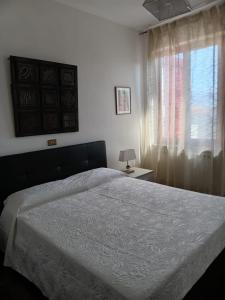 a bedroom with a large bed and a window at La Quiete appartamento in campagna a Spoleto in Spoleto