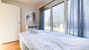 a bedroom with a bed and a large window at Lägenhet - Karlskoga folkhögskola in Karlskoga