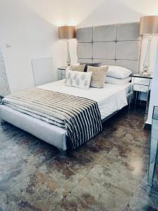 a bedroom with a large bed with two pillows on it at Casa Dolly Boutique B&B in Cantoria