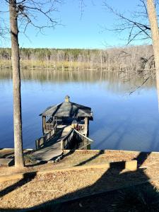 a dock with a gazebo on a lake at Lake Front Sunset | New Deck | Kayaks | Canoe in Salisbury