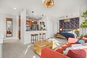 a living room with a couch and a table at The Revive Loft with Balcony, Workspace and Bikes in Fort Collins +13 photos