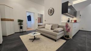 a living room with a couch and a table at Apartment Local Uetendorf in Uetendorf