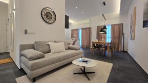 a living room with a couch and a table at Apartment Local Uetendorf in Uetendorf