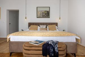 a bedroom with a large bed and a chair at Villa Empress in Dramalj +112 photos
