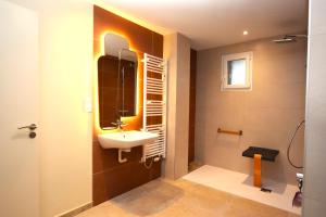 a bathroom with a sink and a mirror at Maison VERNET - Hôtel Beauséjour in Le Béage +66 photos