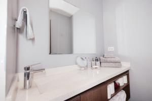 a bathroom with a sink and a mirror at Volcano View Loft, Puebla Skyline1801 in Puebla +51 photos