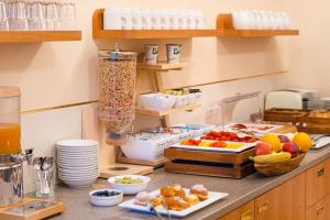 a kitchen with some food on a counter at Villa Marion in Luhačovice