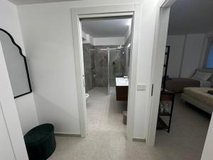 a bathroom with a walk in shower and a toilet in a room at GV Guest House Malpensa in Lonate Pozzolo
