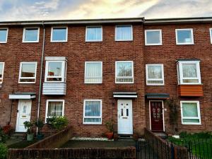 a brick building with white doors and windows at Victory Gate 3 double bed House in Old Portsmouth Parking Pets in Portsmouth +67 photos