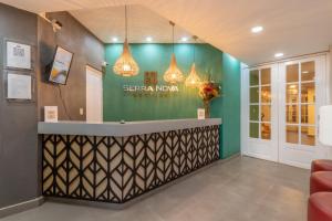 a lobby of a hotel with a reception desk at Hotel Serra Nova in Cajamarca