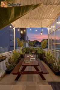 a patio with a table on top of a building at Cubicity Ton That Tung in Ho Chi Minh City
