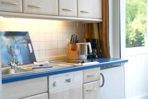 a kitchen with a sink and a counter top at "Residenz Seeblick" Studio 23 mit seitlichem Ostseeblick in Ostseebad Sellin