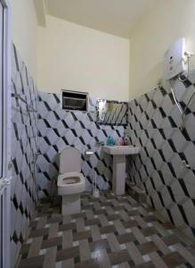 a bathroom with a toilet and a sink at Daya Guest House in Pattipola +24 photos