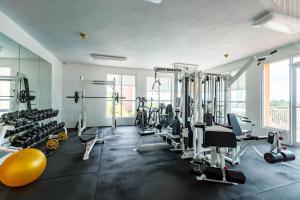 a gym with a lot of tread machines and weights at Island Escape in Fajardo