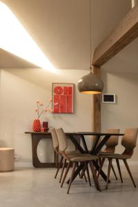 a dining room with a table and chairs at Bommartini Guesthouse in Enschede