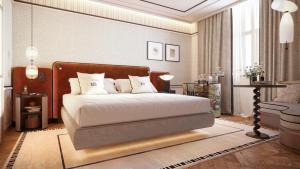 a bedroom with a bed with white sheets and pillows at BLESS Barcelona - New Opening 2026 in Barcelona