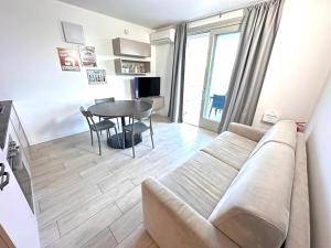 a living room with a couch and a table at Iseo Panorama Suite in Parzanica +12 photos