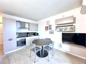 a kitchen with a table and chairs in a room at Iseo Panorama Suite in Parzanica
