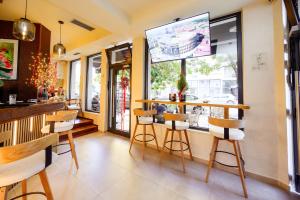 a restaurant with a bar with chairs and a window at Hotel MB in Metković +34 photos