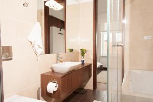 a bathroom with a sink and a mirror at Centroom Apartment Zagreb in Zagreb