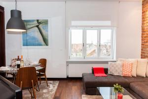 a living room with a couch and a table at Centroom Apartment Zagreb in Zagreb +9 photos