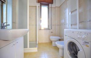 a bathroom with a sink and a washing machine at Casa Vincenzo in Satriano