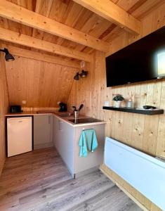 a kitchen with a sink and a sink at Tiny house in Saint-Rémy-Boscrocourt