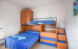 a bedroom with a bunk bed and a blue bed at Casa Vincenzo in Satriano