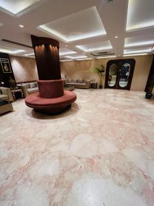 a large room with a top hat on the floor at Grove Residency Huaz Khas New Delhi - Couple Friendly in New Delhi